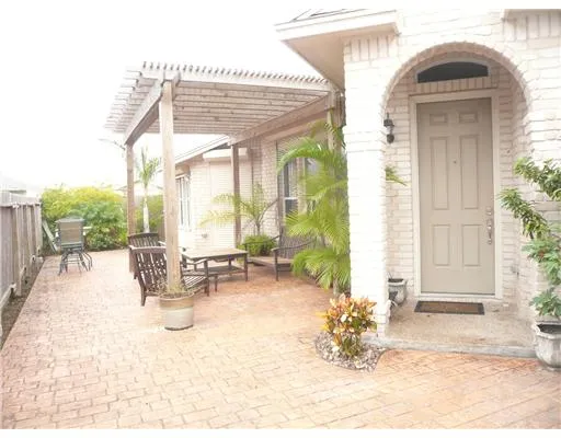 a view of living room filled with furniture and floor to ceiling window