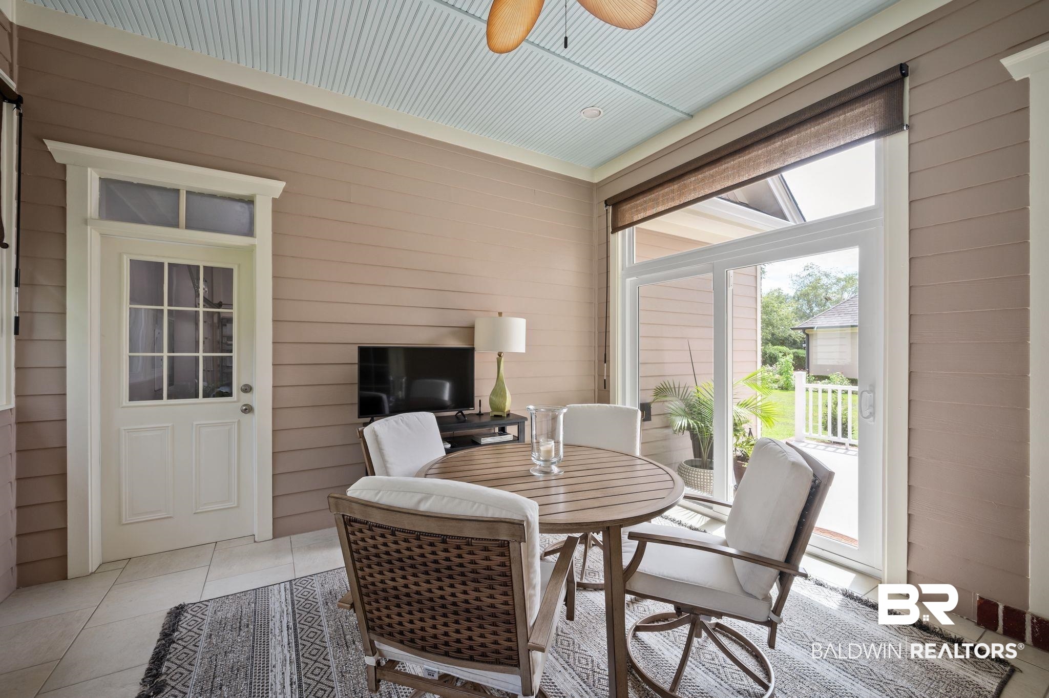 905 Buttercup Lane Foley, AL 36535 - Photo 36 of 47 Dining area with wood walls, light tile patterned flooring, and a ceiling fan