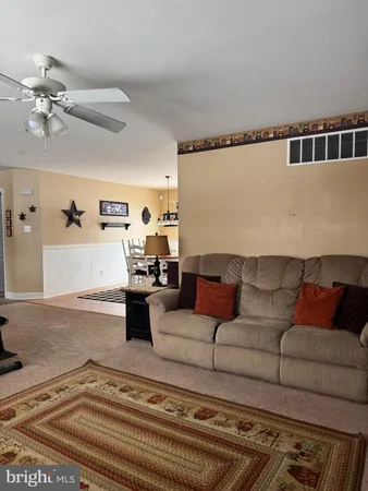 a living room with furniture and a rug