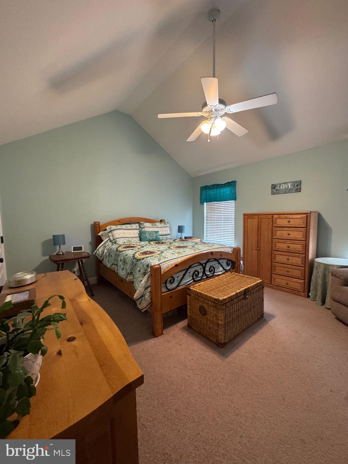 5432 Lake Road Newfield, NJ 08344 - Photo 12 of 24 a bedroom with bed and a chandelier