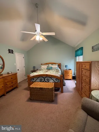 a bedroom with furniture and a chandelier