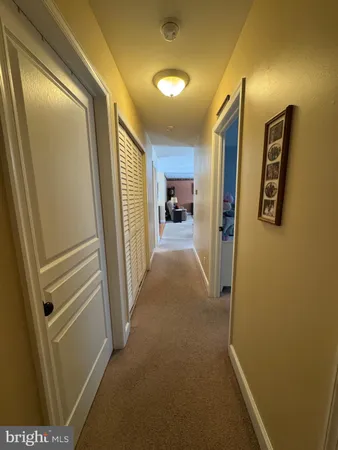 a view of a hallway with a door