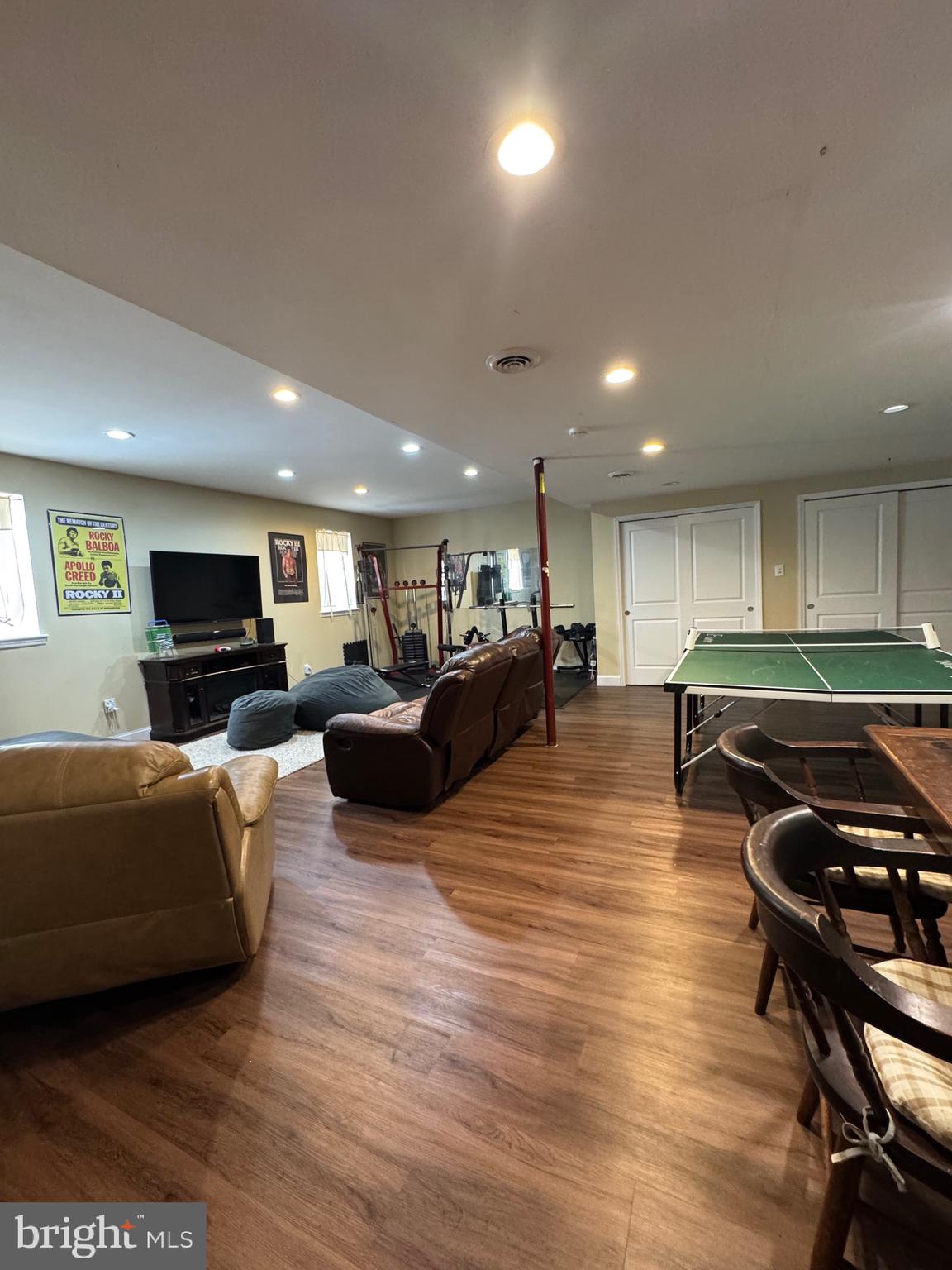 5432 Lake Road Newfield, NJ 08344 - Photo 20 of 24 a living room with furniture a wooden floor and a sink
