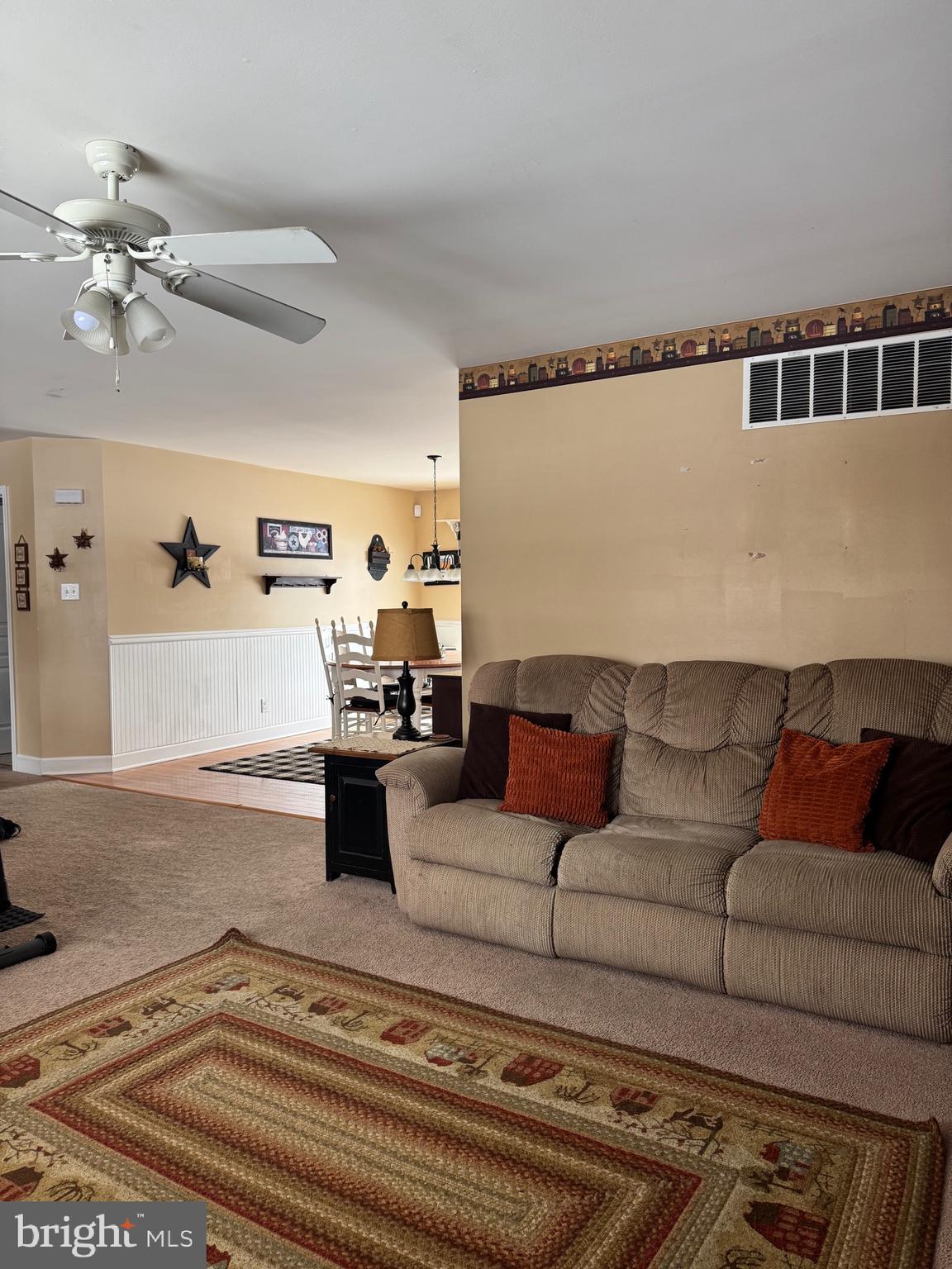 5432 Lake Road Newfield, NJ 08344 - Photo 5 of 24 a living room with furniture and a rug