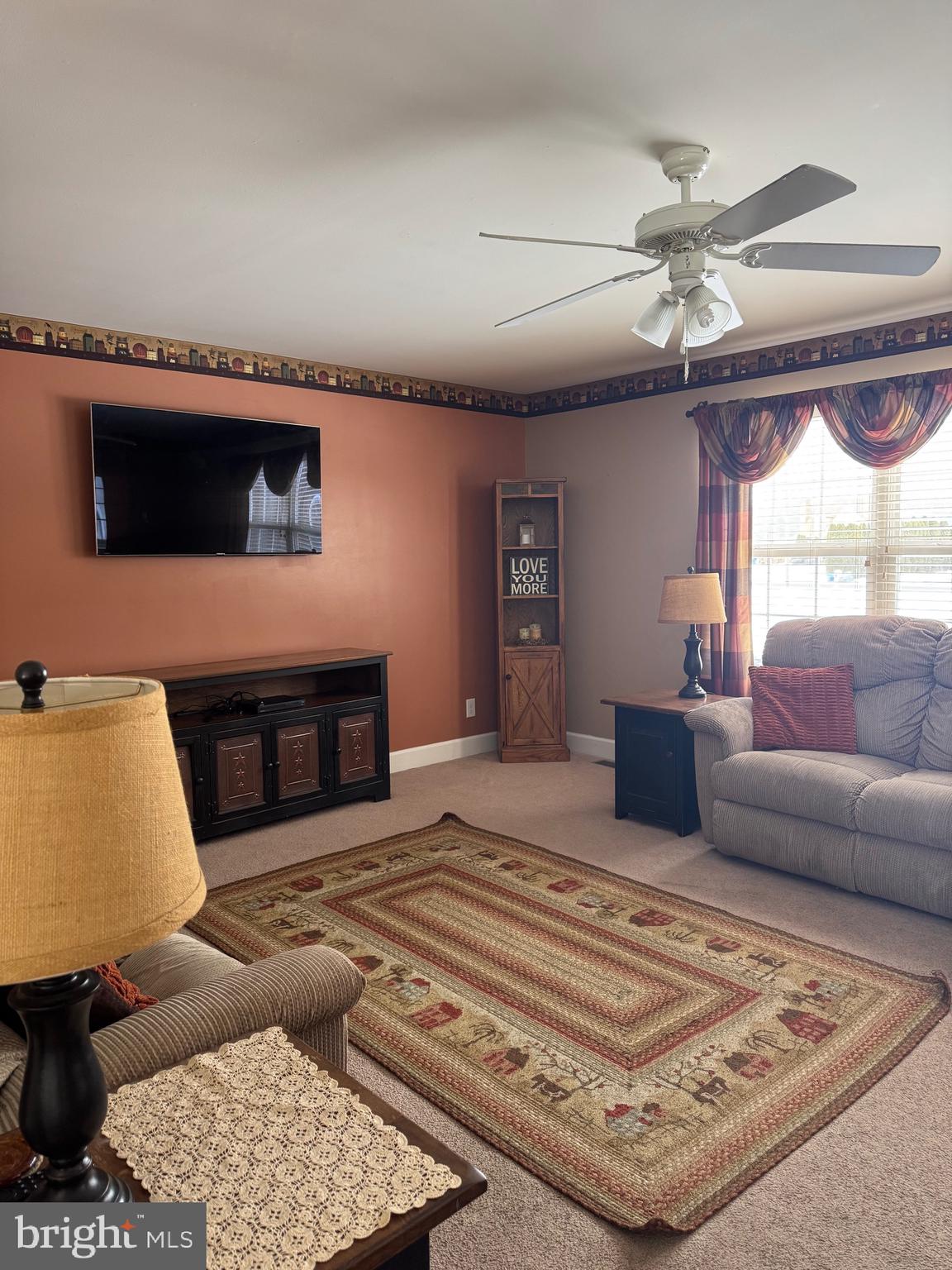 5432 Lake Road Newfield, NJ 08344 - Photo 7 of 24 a living room with furniture and a fireplace