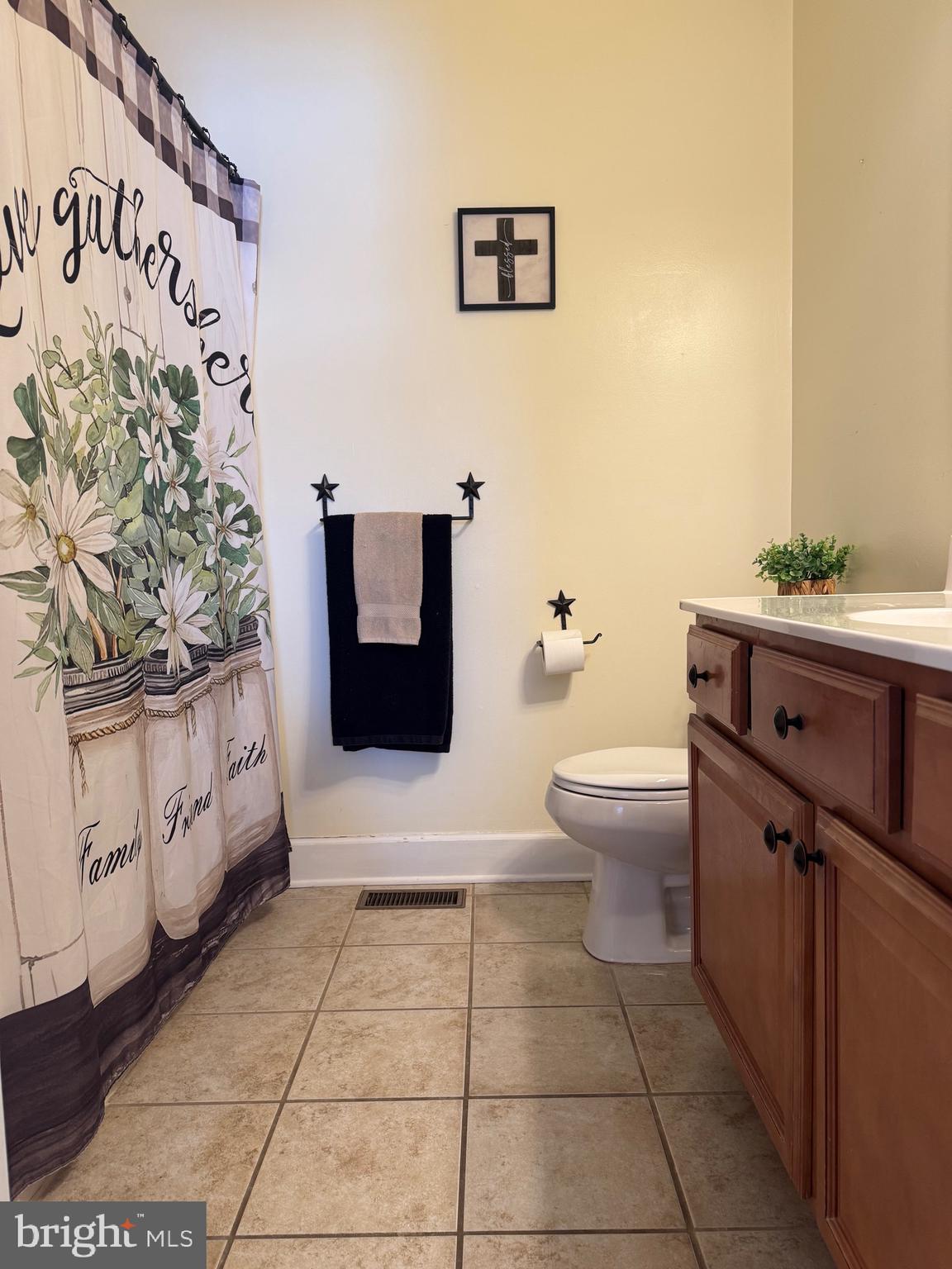 5432 Lake Road Newfield, NJ 08344 - Photo 8 of 24 a bathroom with a toilet and a shower