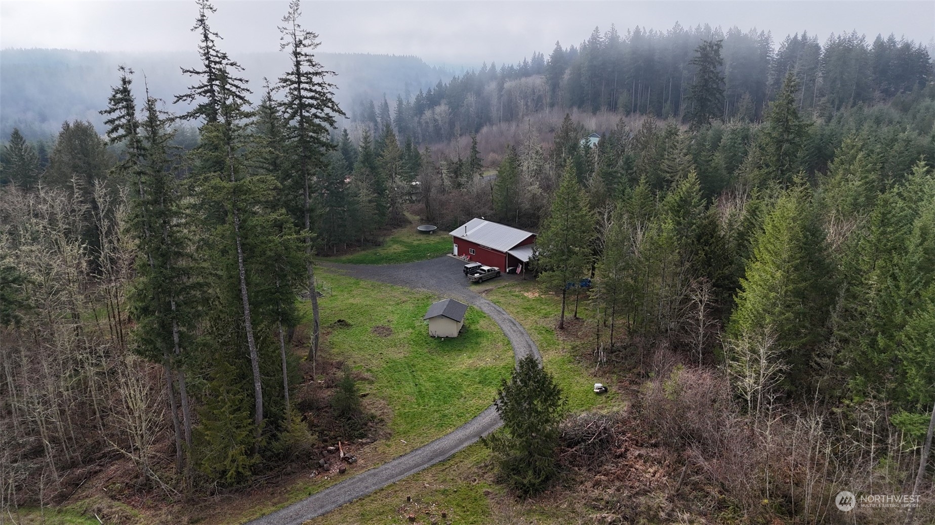 65038 Logan Hill Road Chehalis, WA 98532 - Photo 3 of 33 a view of a forest with a house