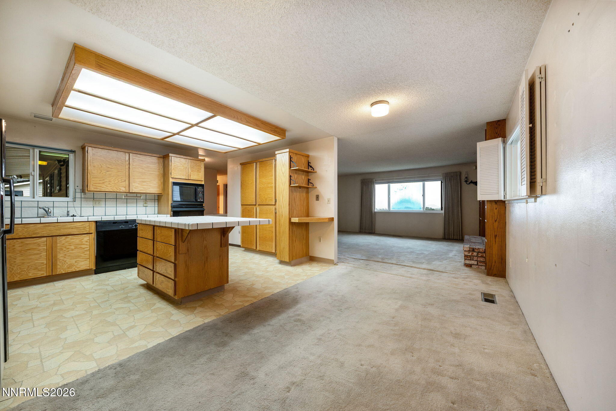 2685 Everett Drive Reno, NV 89503 - Photo 19 of 40 a view of a kitchen with a sink and a refrigerator