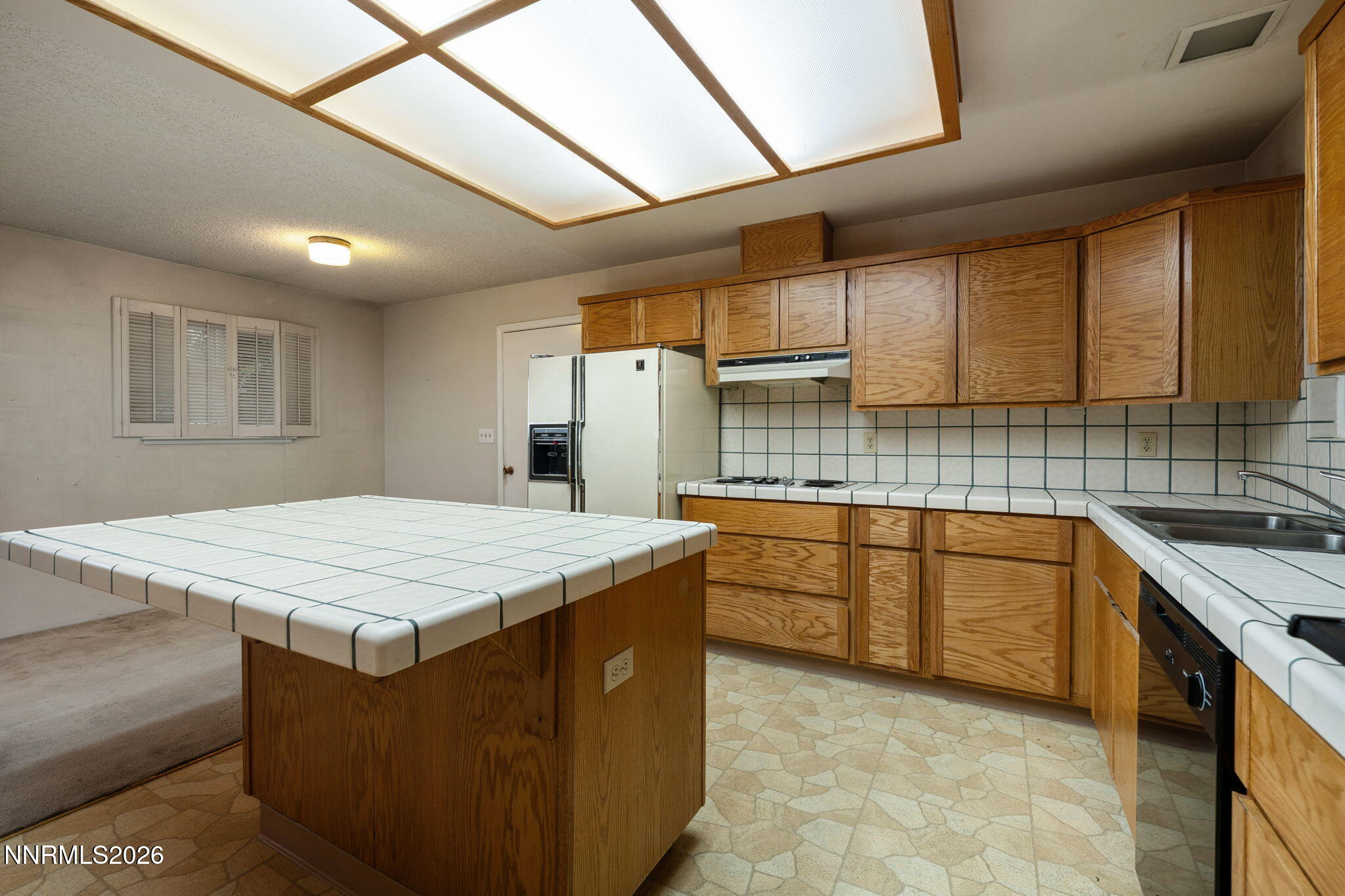 2685 Everett Drive Reno, NV 89503 - Photo 20 of 40 a kitchen with stainless steel appliances granite countertop wooden cabinets sink and stove