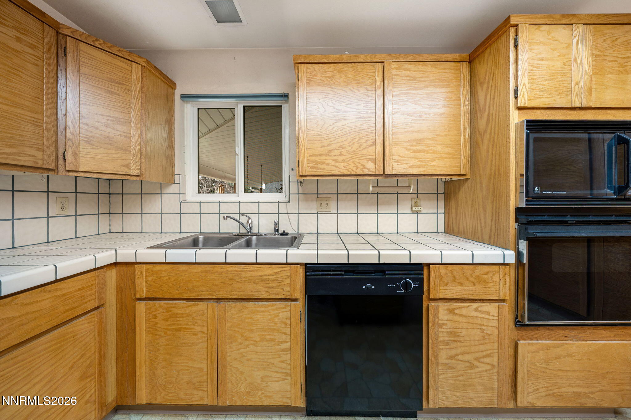 2685 Everett Drive Reno, NV 89503 - Photo 23 of 40 a kitchen with a sink a stove and a refrigerator