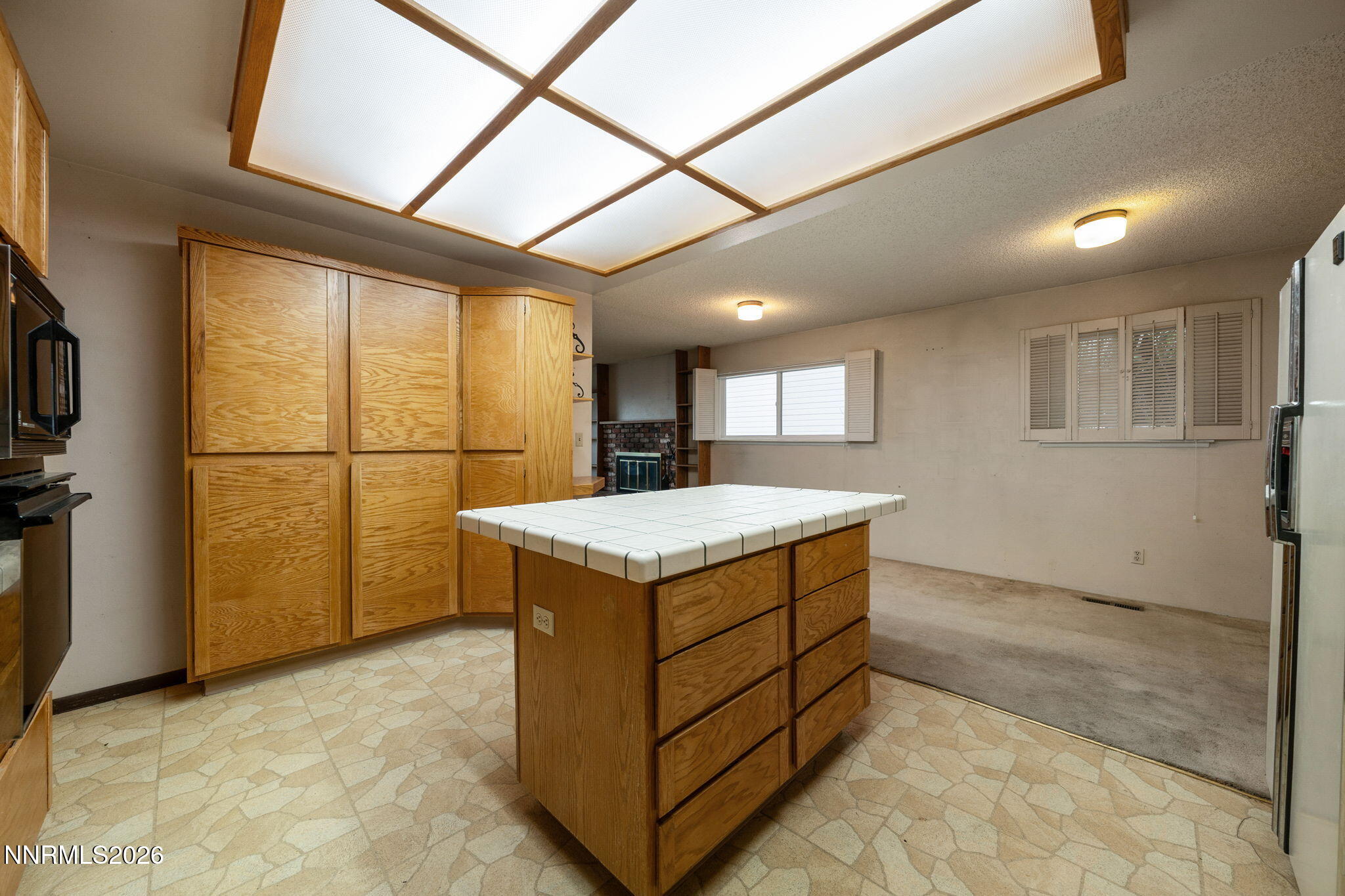 2685 Everett Drive Reno, NV 89503 - Photo 24 of 40 a kitchen with stainless steel appliances granite countertop a sink and a refrigerator