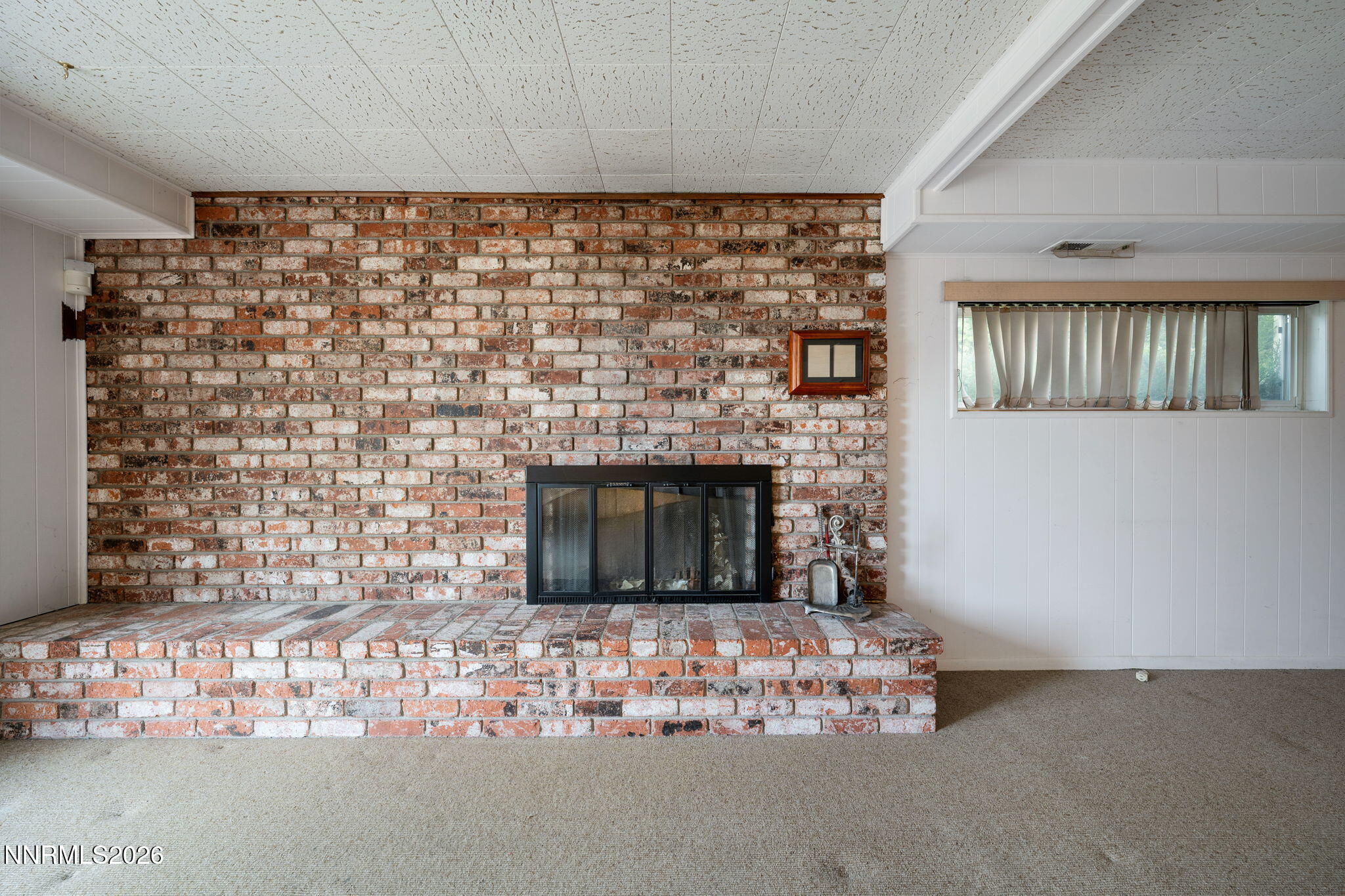 2685 Everett Drive Reno, NV 89503 - Photo 27 of 40 a living room with a fireplace