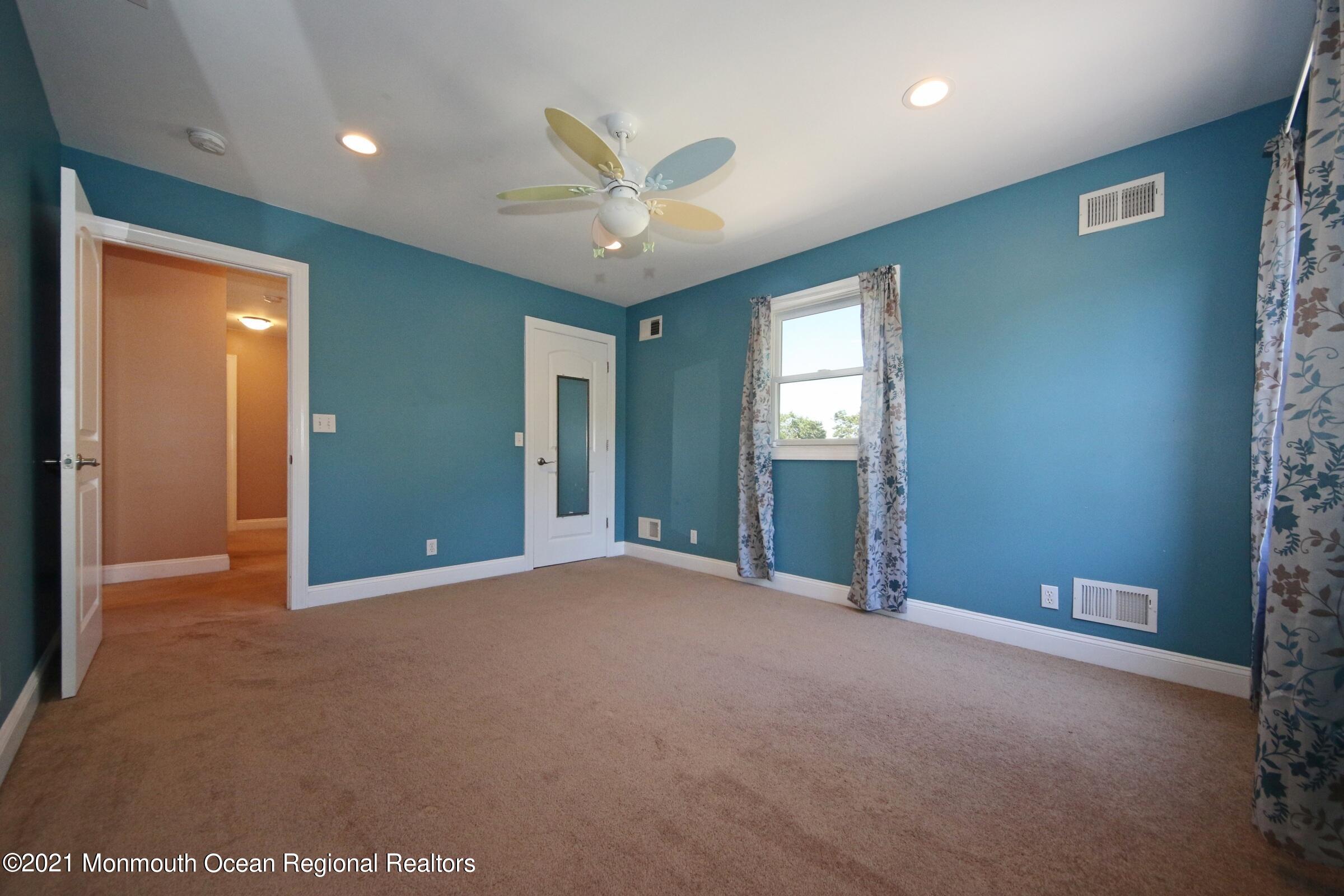 27 Demmert Avenue Rumson, NJ 07760 - Photo 14 of 38 a view of an empty room with window and cabinet