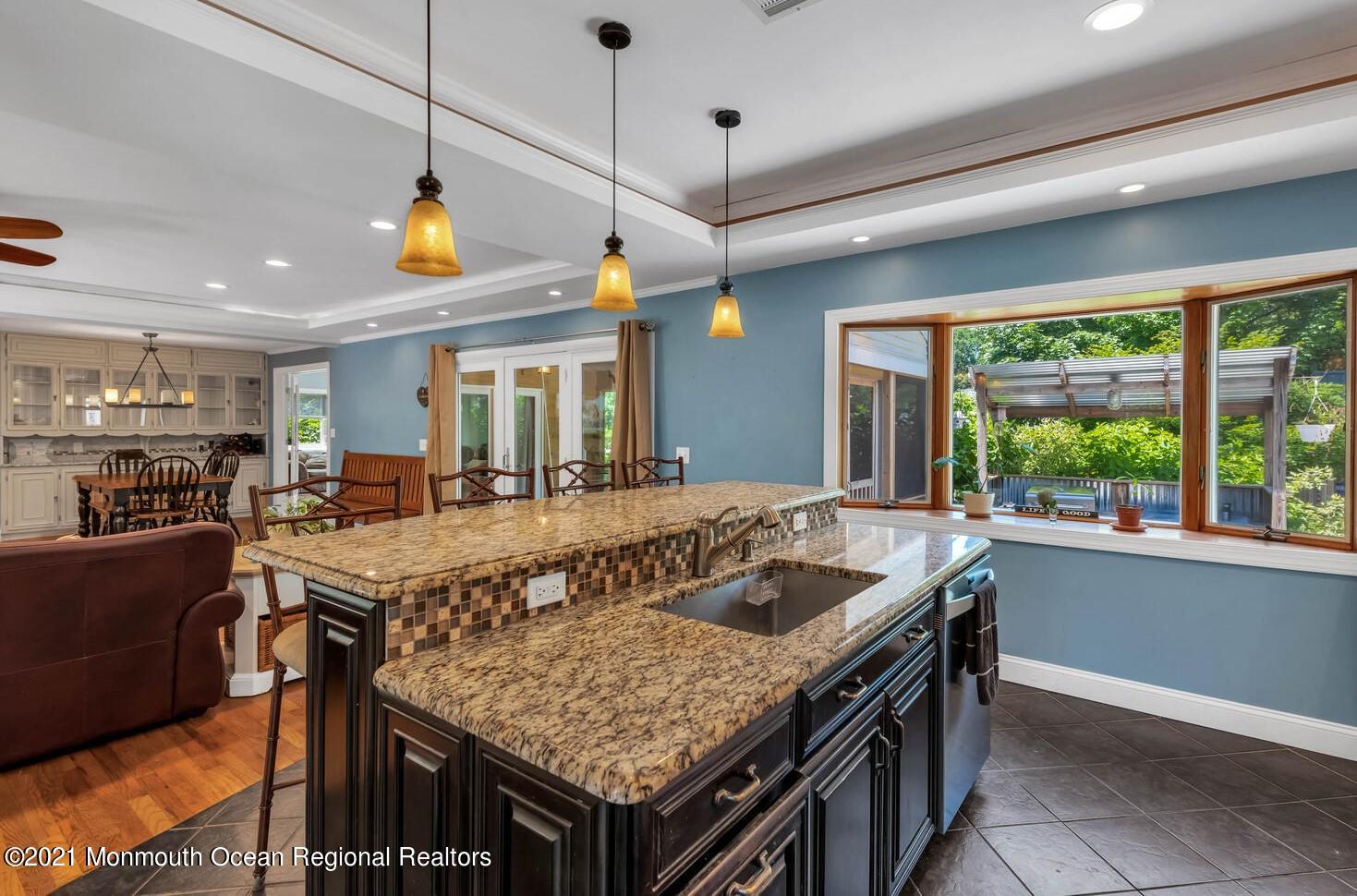 27 Demmert Avenue Rumson, NJ 07760 - Photo 3 of 38 a kitchen with a stove and a center island