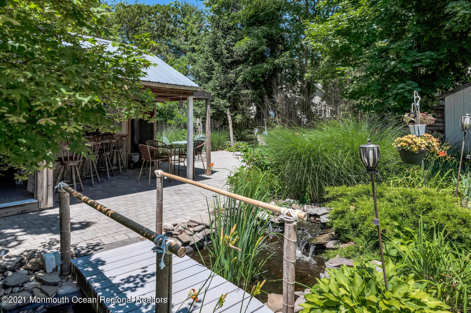 27 Demmert Avenue Rumson, NJ 07760 - Photo 21 of 38 a view of a chair and tables in the patio