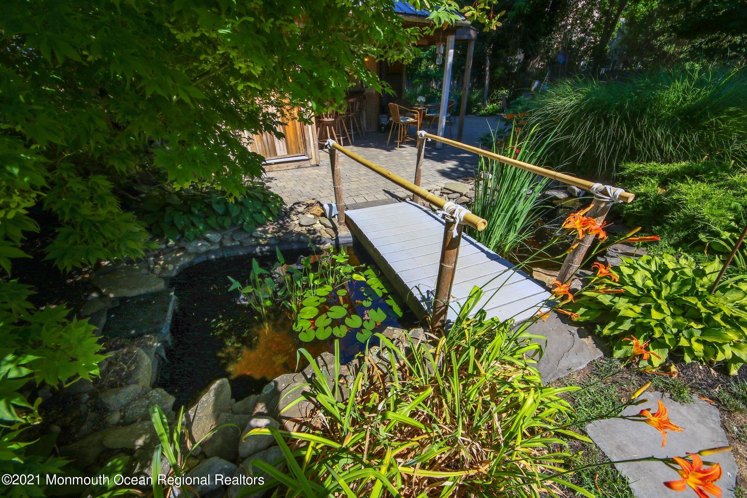 27 Demmert Avenue Rumson, NJ 07760 - Photo 23 of 38 a view of a house with a flower garden