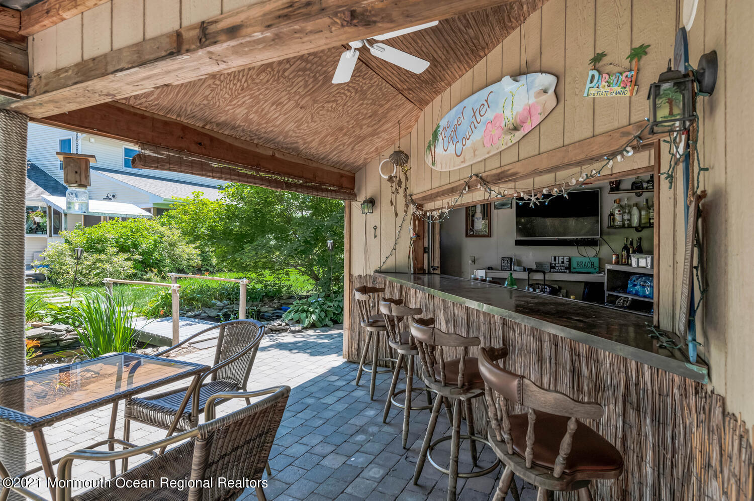 27 Demmert Avenue Rumson, NJ 07760 - Photo 24 of 38 a dining area with furniture and outdoor space