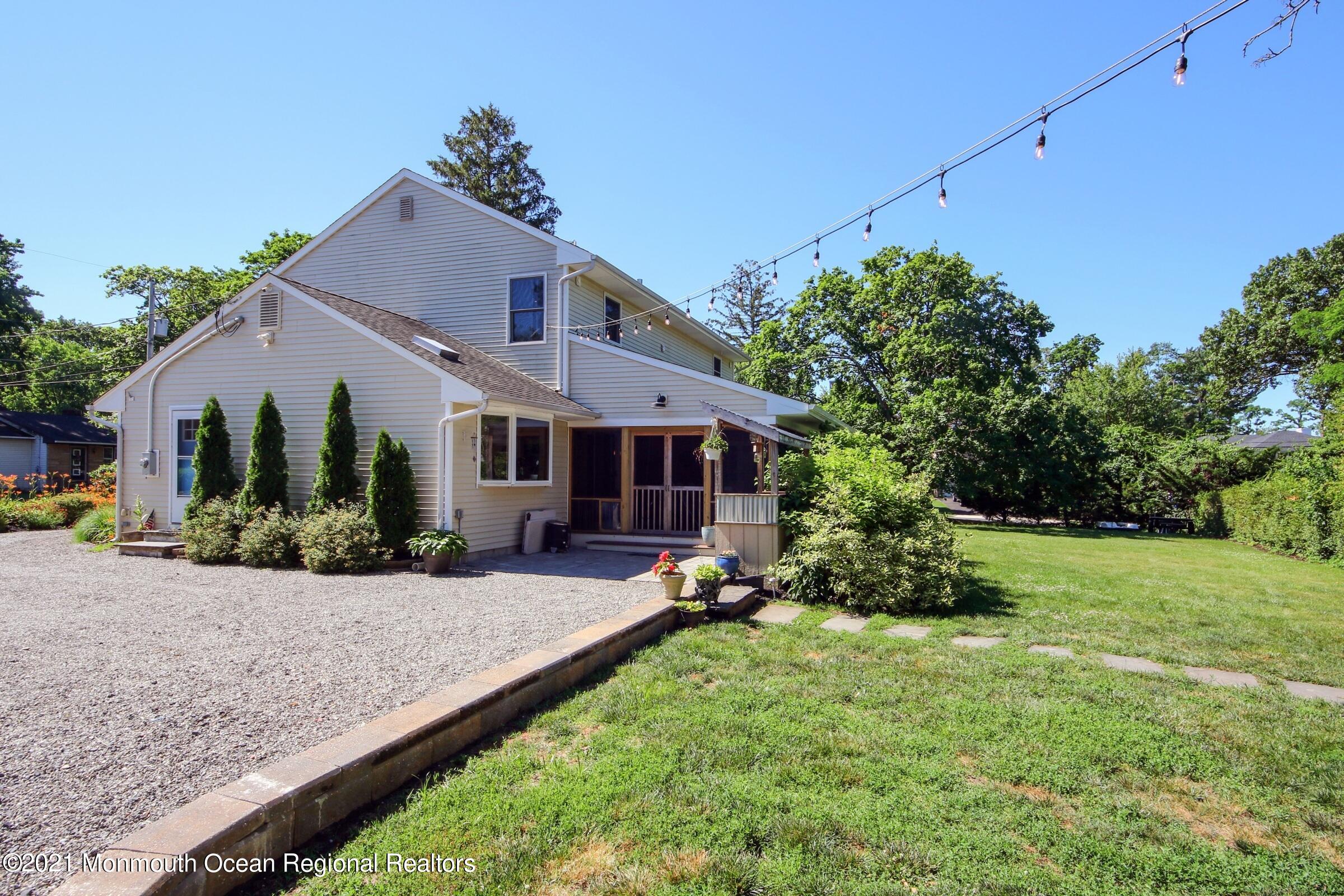 27 Demmert Avenue Rumson, NJ 07760 - Photo 30 of 38 a front view of a house with garden