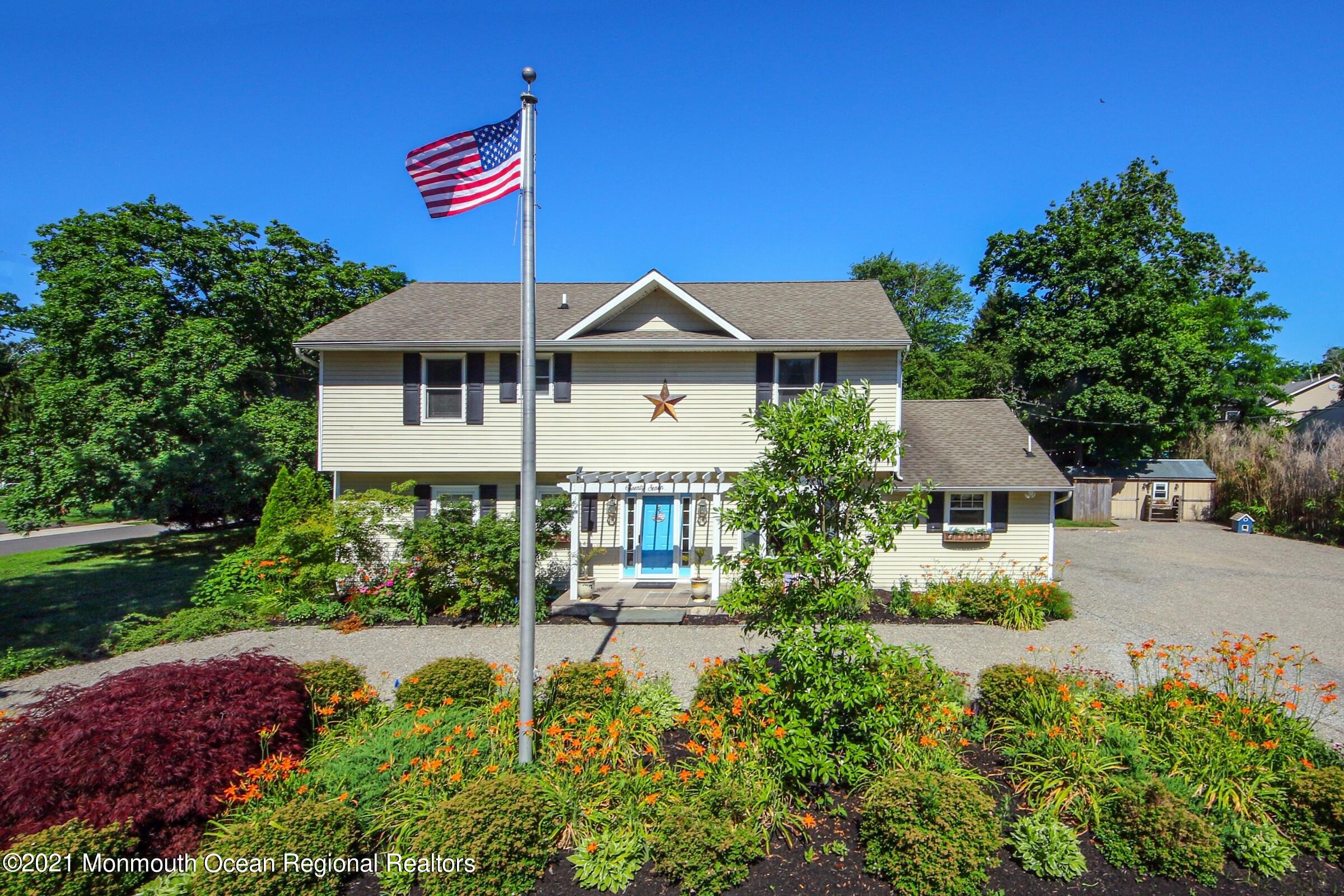 27 Demmert Avenue Rumson, NJ 07760 - Photo 31 of 38 a front view of a house with a yard
