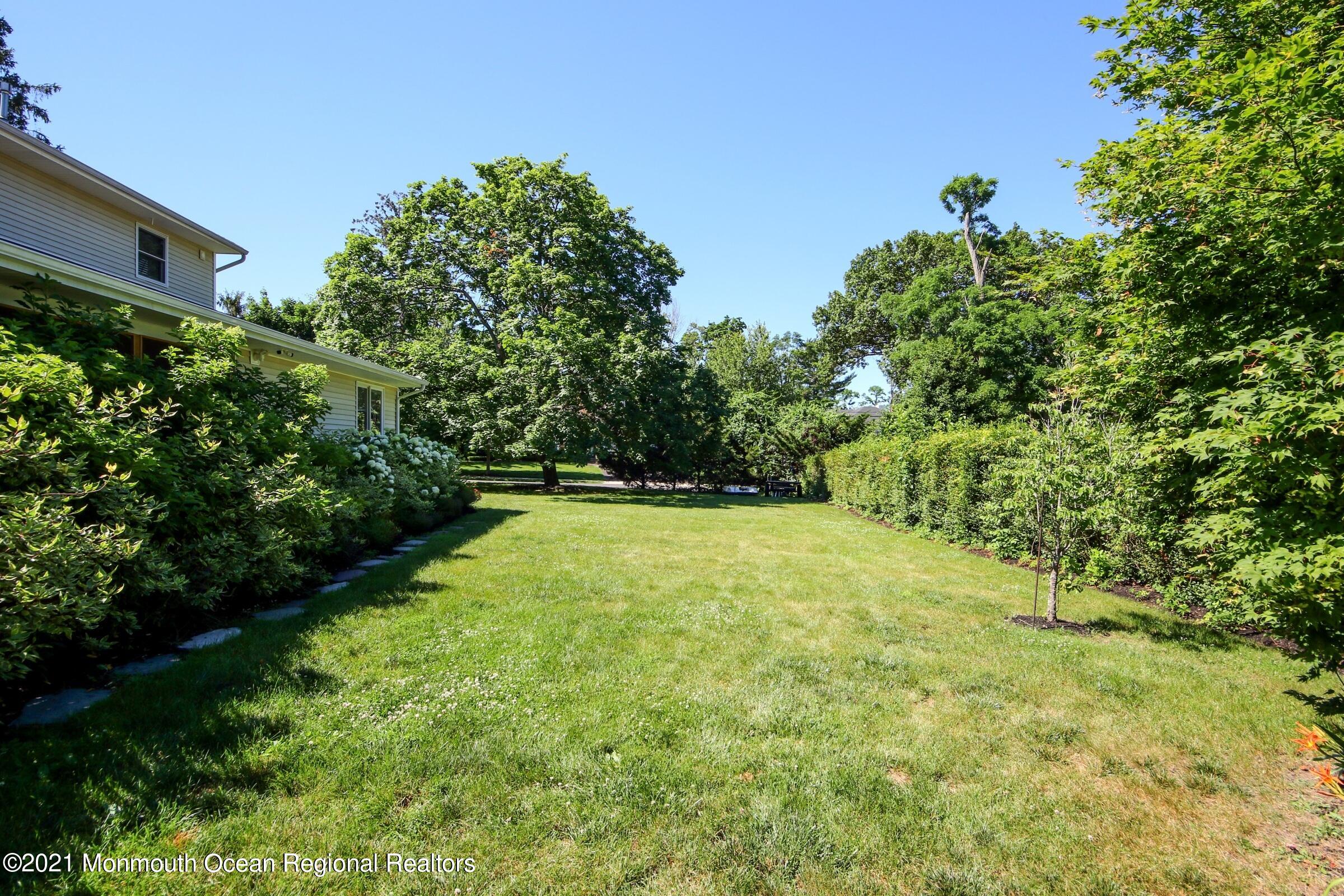 27 Demmert Avenue Rumson, NJ 07760 - Photo 32 of 38 a view of a yard with a tree