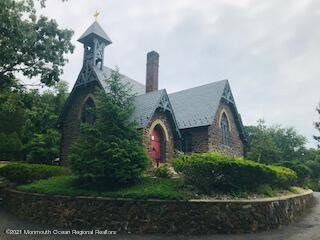 27 Demmert Avenue Rumson, NJ 07760 - Photo 36 of 38 a front view of a house with a yard and garage