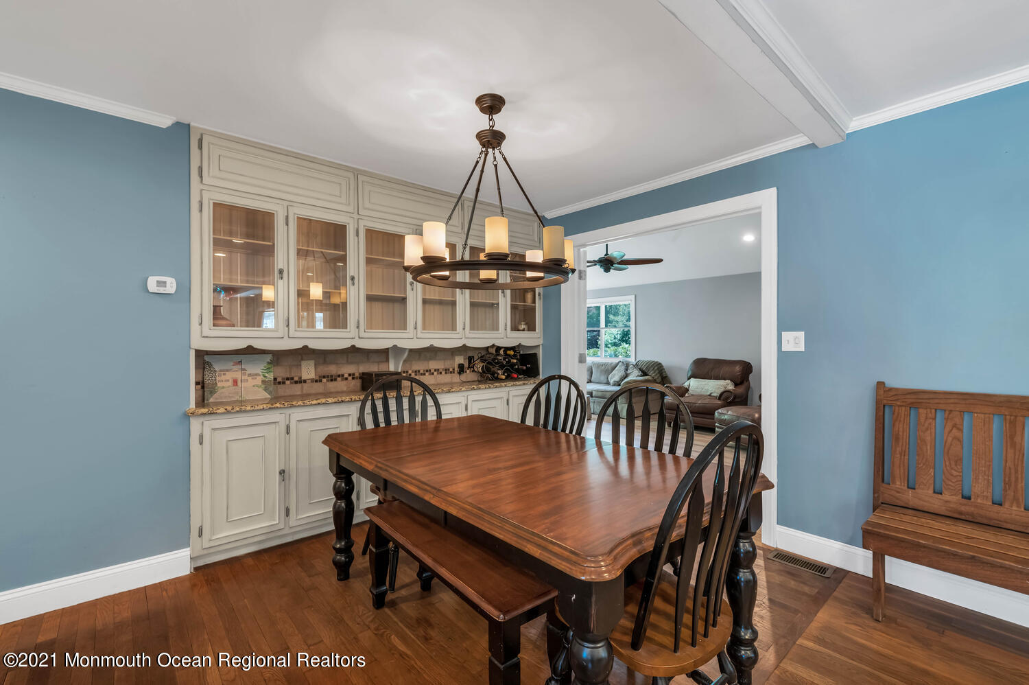 27 Demmert Avenue Rumson, NJ 07760 - Photo 6 of 38 a dining room with furniture a chandelier and wooden floor