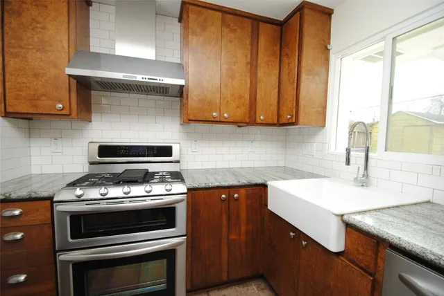a kitchen with a stove and a sink