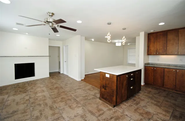 a kitchen with stainless steel appliances granite countertop a stove and a sink