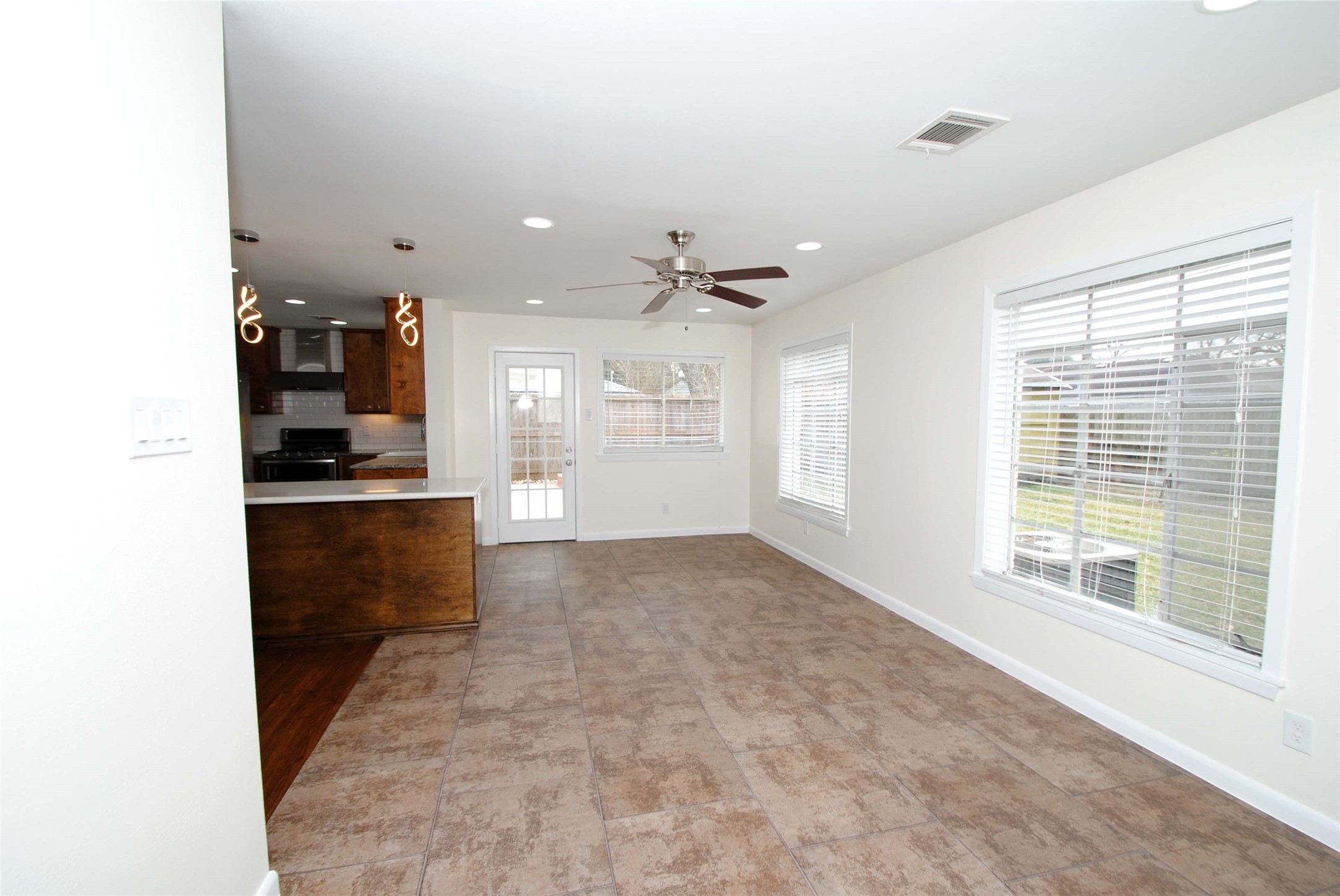 7953 Ridgeview Drive Houston, TX 77055 - Photo 15 of 29 a view of an empty room with kitchen and a window