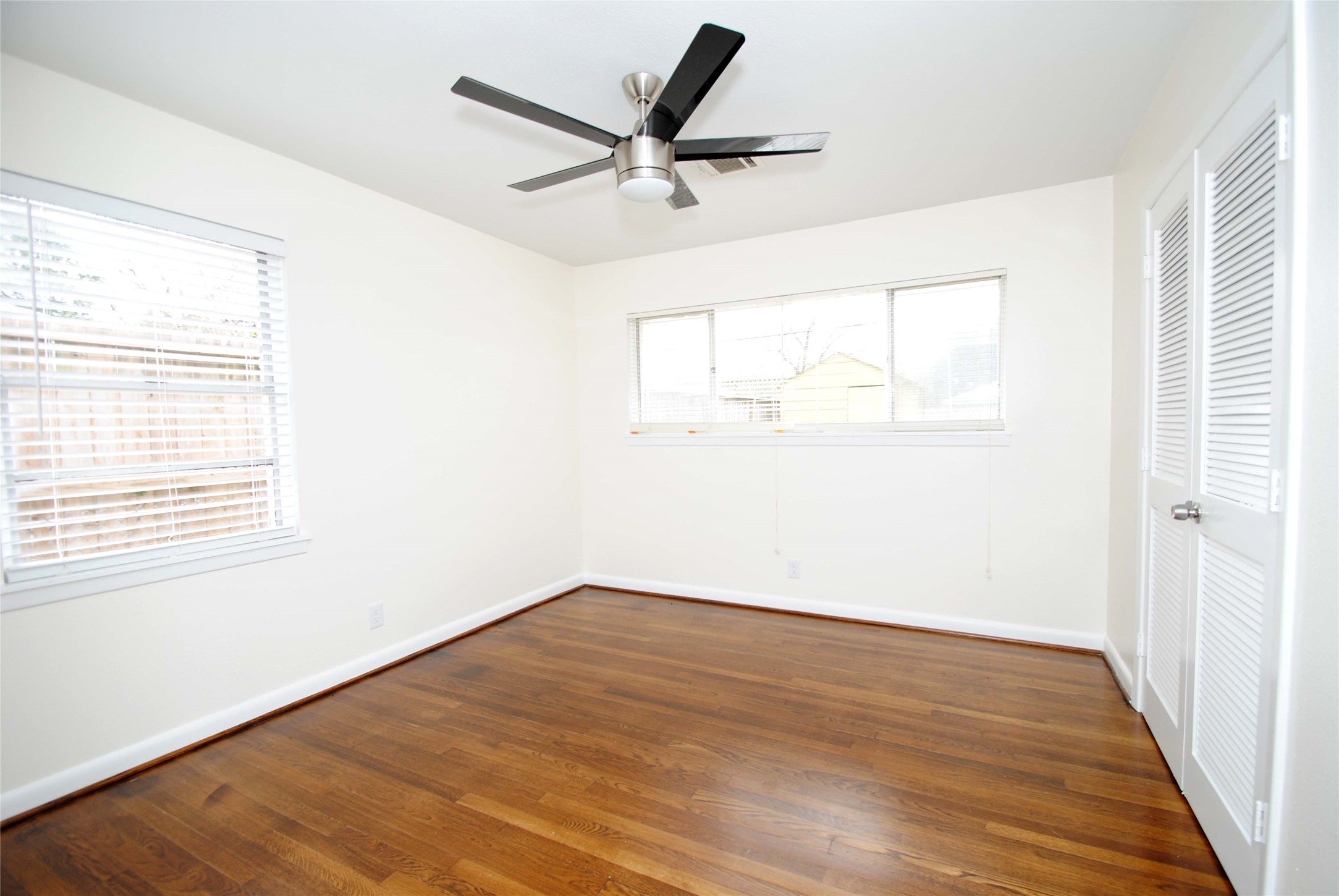 7953 Ridgeview Drive Houston, TX 77055 - Photo 20 of 29 a view of a big room with wooden floor and a window