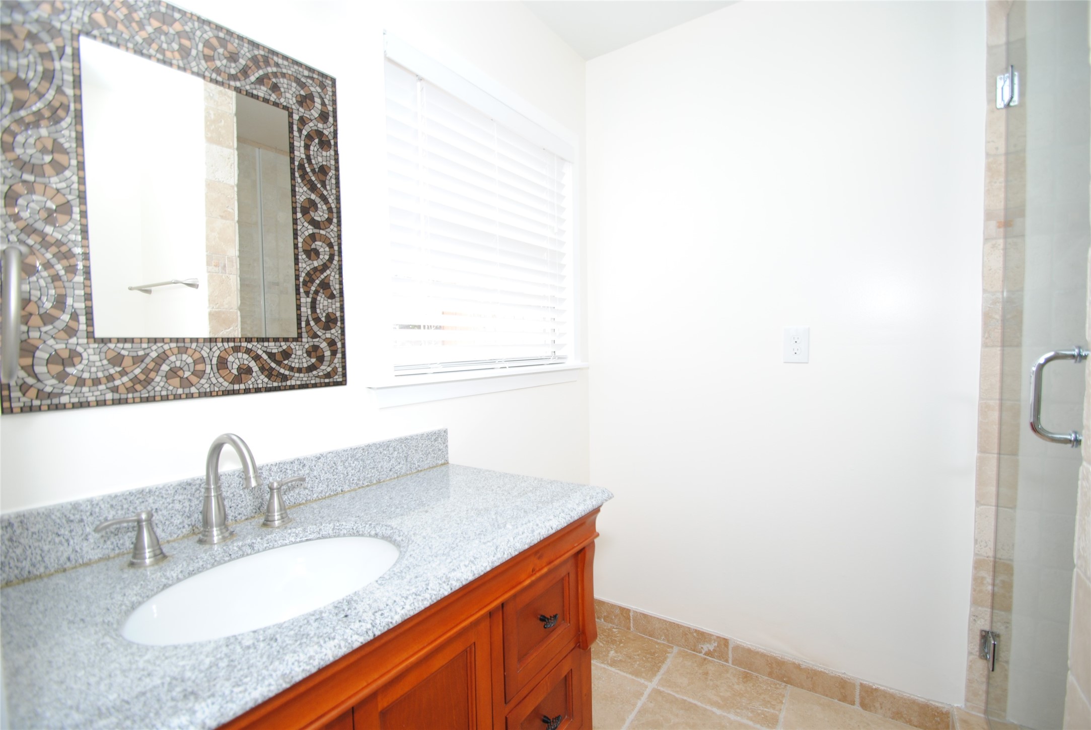 7953 Ridgeview Drive Houston, TX 77055 - Photo 24 of 29 a bathroom with a granite countertop sink and a mirror