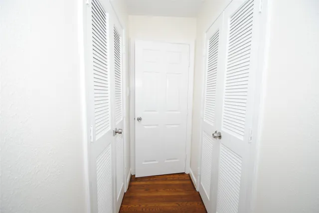 a view of a bathroom from a hallway