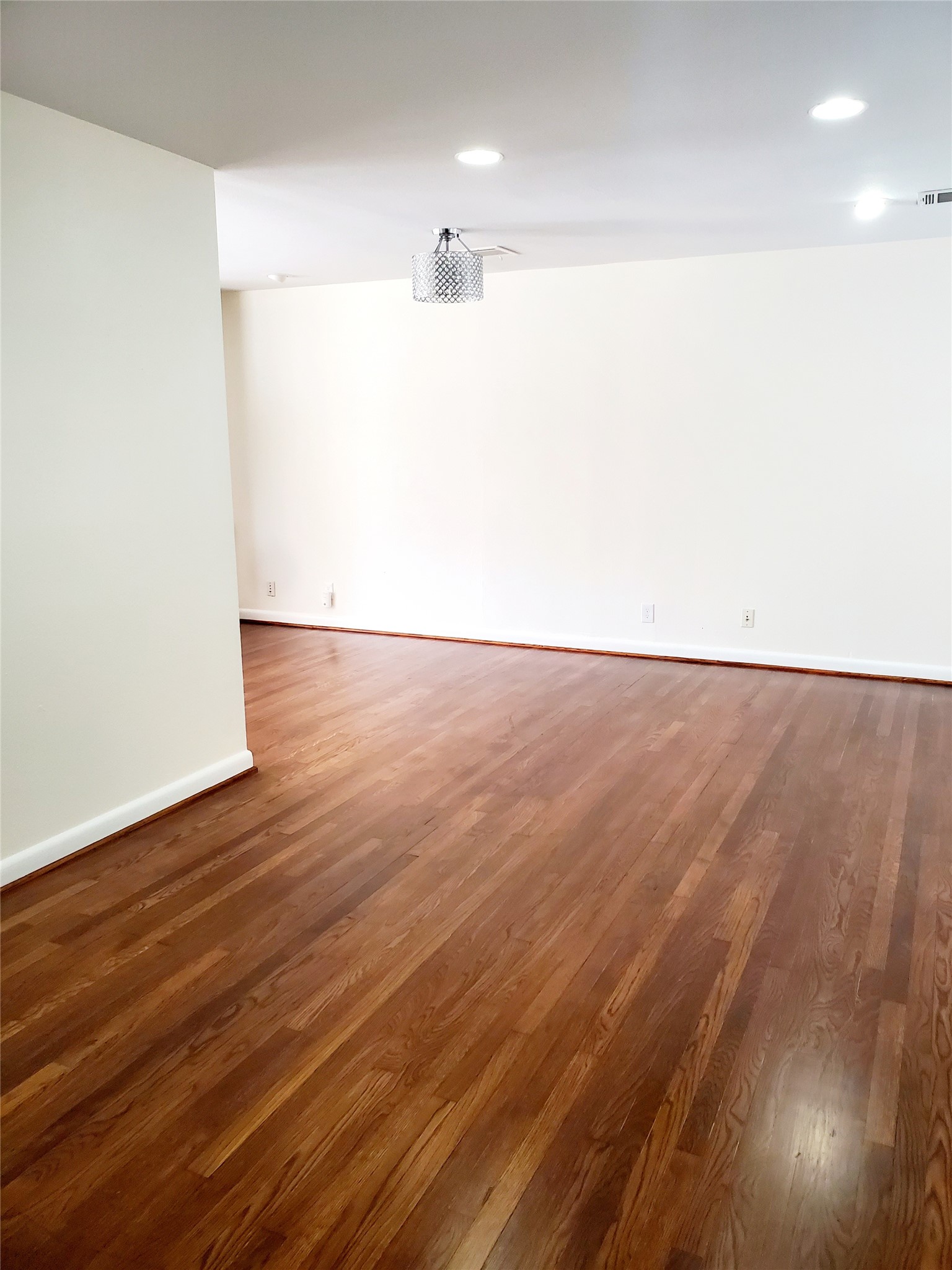 7953 Ridgeview Drive Houston, TX 77055 - Photo 6 of 29 a view of an empty room with wooden floor