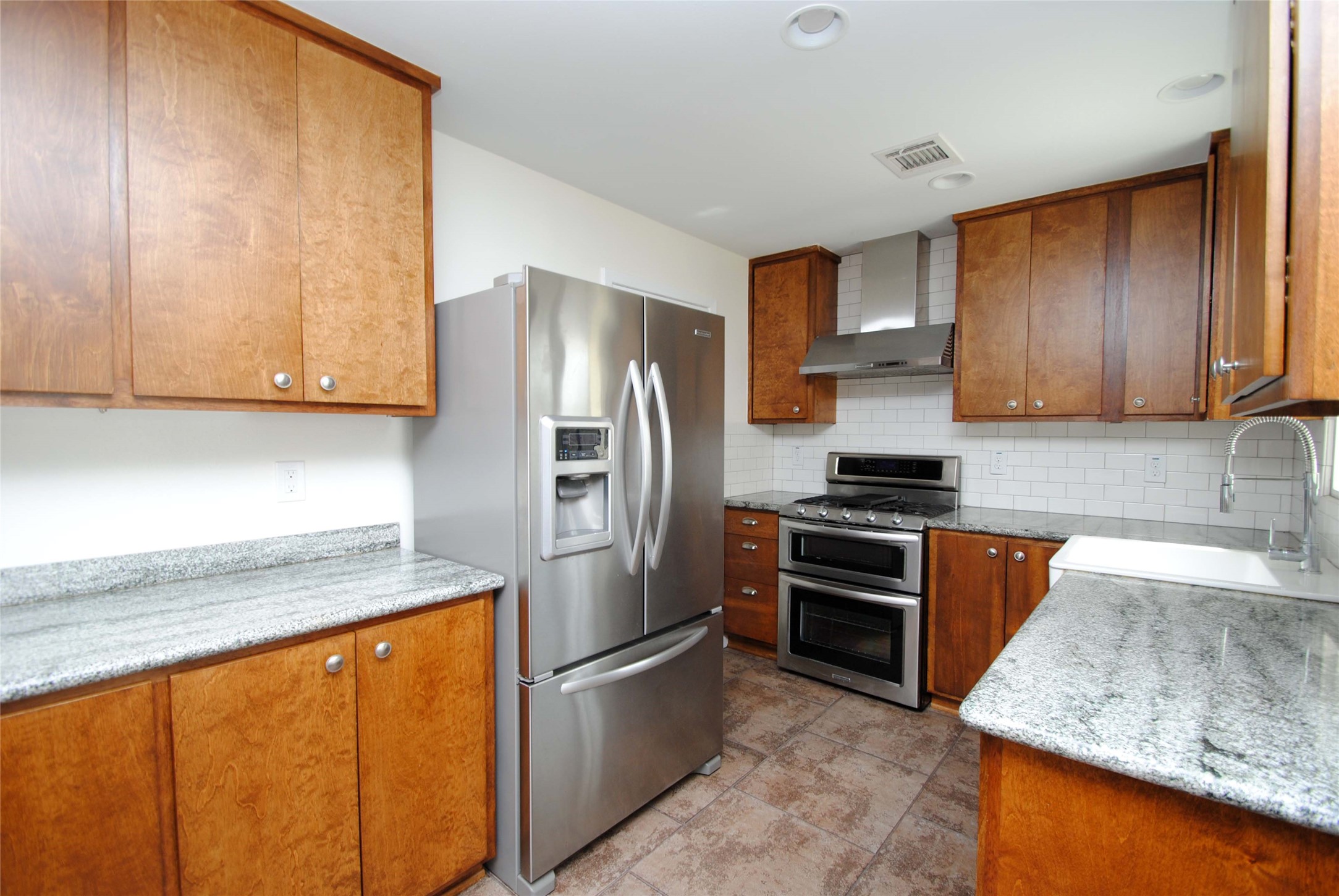 7953 Ridgeview Drive Houston, TX 77055 - Photo 8 of 29 a kitchen with stainless steel appliances granite countertop a refrigerator stove and sink