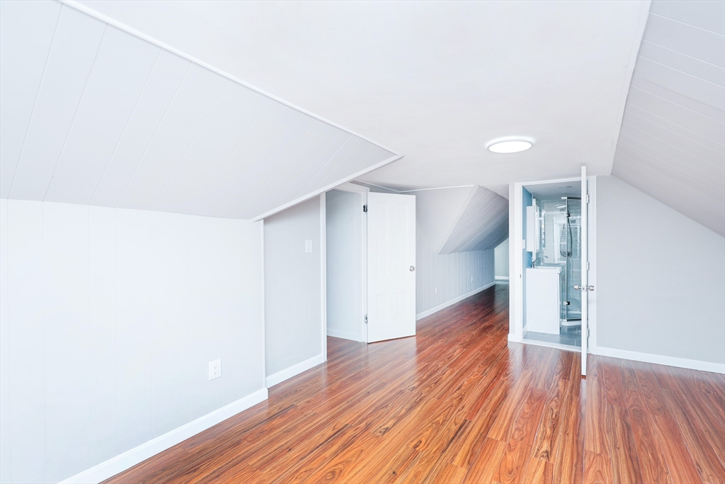 15-17 Saunders Street, Unit 15 Boston, MA 02134 - Photo 16 of 22 a view of empty room with wooden floor