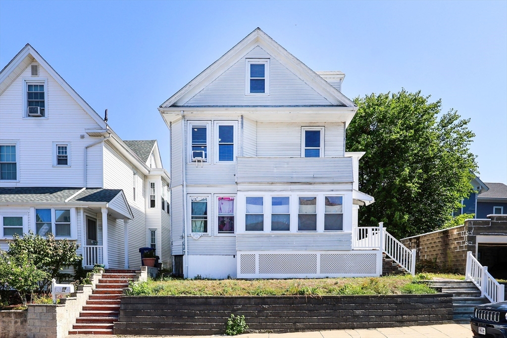 15-17 Saunders Street, Unit 15 Boston, MA 02134 - Photo 21 of 22 a front view of a house with a yard