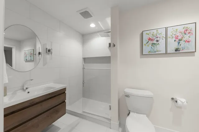 an empty room with furniture and a view of living room