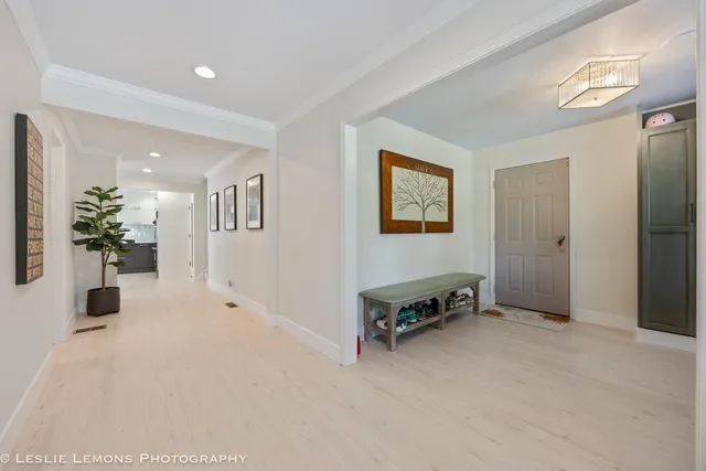 a living room with furniture and a book shelf