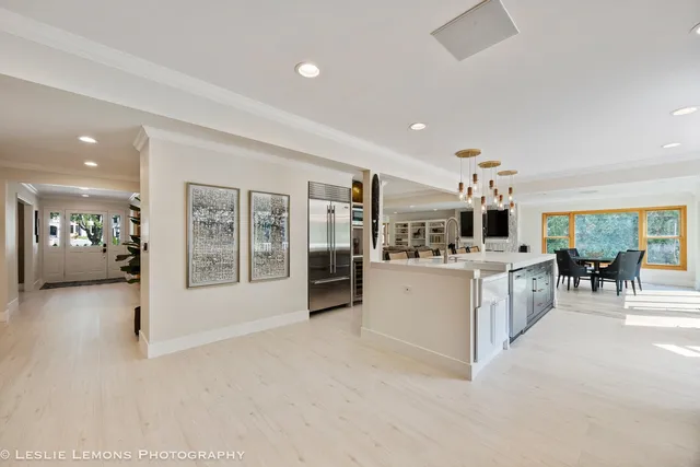a kitchen with a sink a stove and cabinets