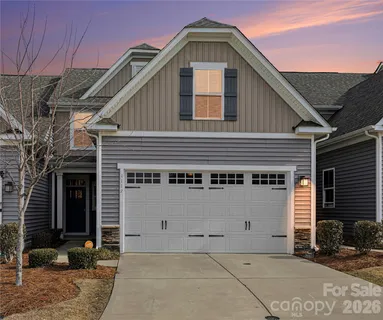 a front view of a house with parking area
