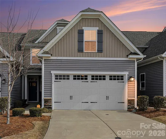 a front view of a house with parking area