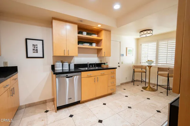 a kitchen with a sink and cabinets