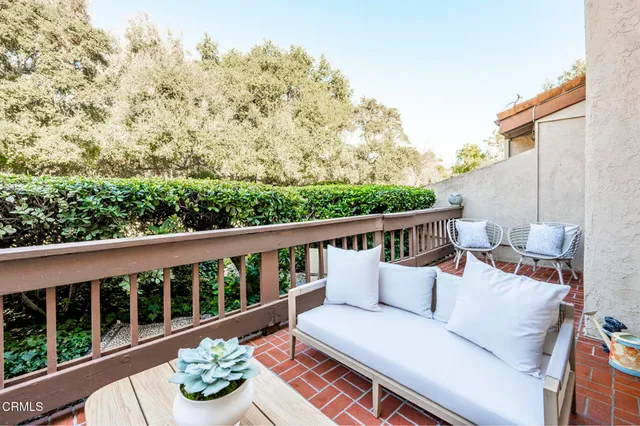 a view of a two chairs in the roof deck