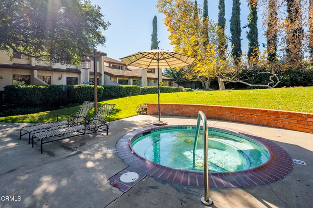 a view of a swimming pool with a patio