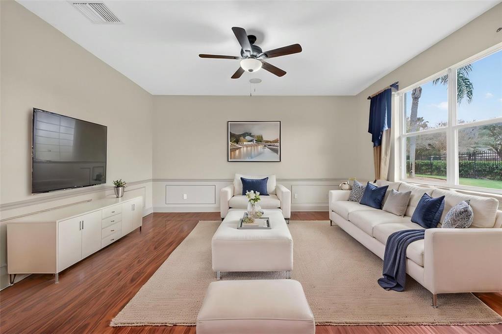 3463 Forest Ridge Lane Kissimmee, FL 34741 - Photo 13 of 58 a living room with furniture or couch and a flat screen tv
