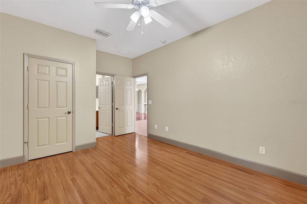3463 Forest Ridge Lane Kissimmee, FL 34741 - Photo 16 of 58 a view of an empty room with wooden floor