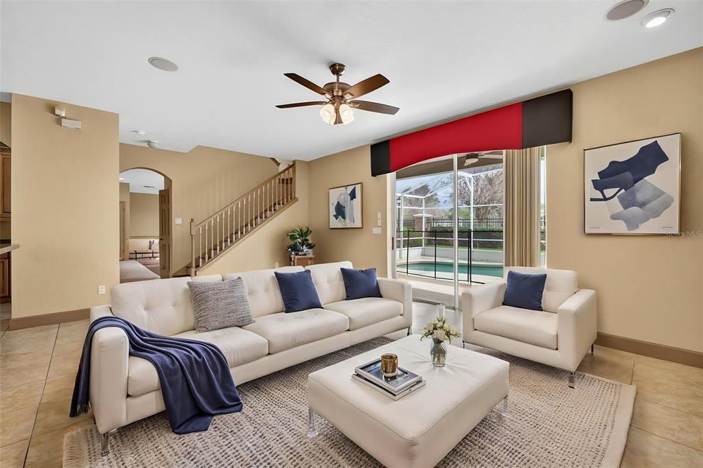 3463 Forest Ridge Lane Kissimmee, FL 34741 - Photo 20 of 58 a living room with furniture and a large window