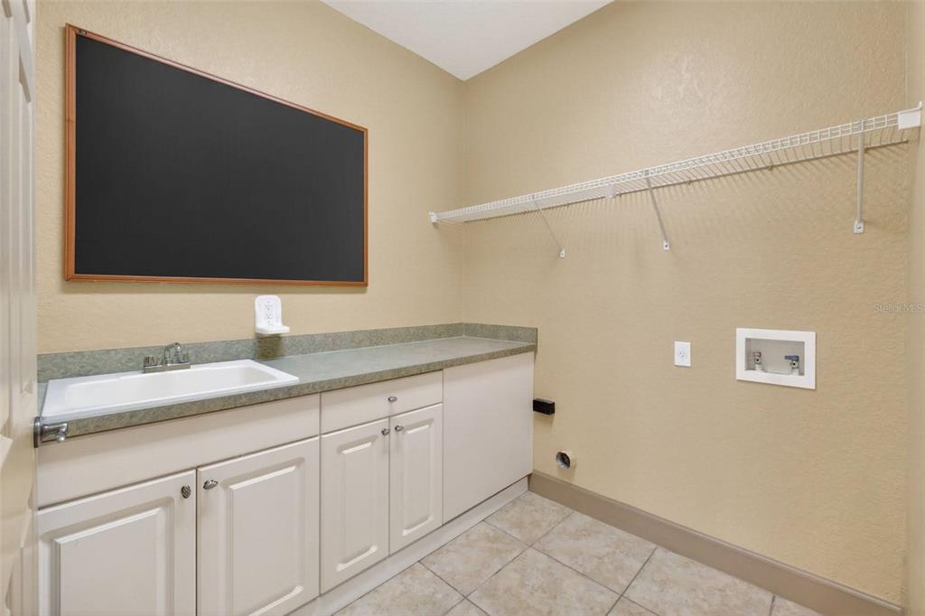 3463 Forest Ridge Lane Kissimmee, FL 34741 - Photo 25 of 58 a bathroom with a sink and mirror
