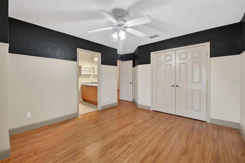 3463 Forest Ridge Lane Kissimmee, FL 34741 - Photo 41 of 58 a view of an empty room with wooden floor