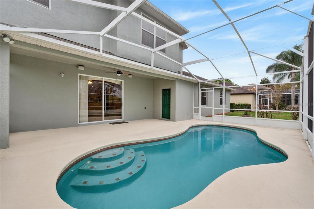 3463 Forest Ridge Lane Kissimmee, FL 34741 - Photo 49 of 58 a view of a white building with swimming pool